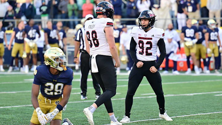 Northern Illinois Huskies kicker Kanon Woodill kicks the game winning field goal in the fourth quarter against the Notre Dame Fighting Irish. Northern Illinois Huskies kicker Kanon Woodill kicks the game winning field goal in the fourth quarter against the Notre Dame Fighting Irish.