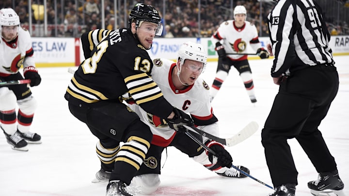 Mar 19, 2024; Boston, Massachusetts, USA;  Boston Bruins center Charlie Coyle (13) and Ottawa Senators left wing Brady Tkachuk (7) battle after a face off during the second period at TD Garden. Mandatory Credit: Bob DeChiara-USA TODAY Sports