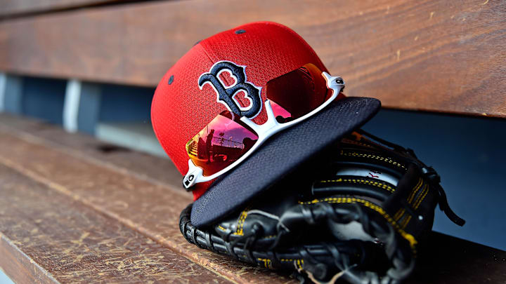 Mar 5, 2019; West Palm Beach, FL, USA; A detailed view of a Boston Red Sox cap, sunglasses and glove in the dugout  during a spring training game between the Washington Nationals and the Boston Red Sox at FITTEAM Ballpark of the Palm Beaches. Mandatory Credit: Jasen Vinlove-Imagn Images