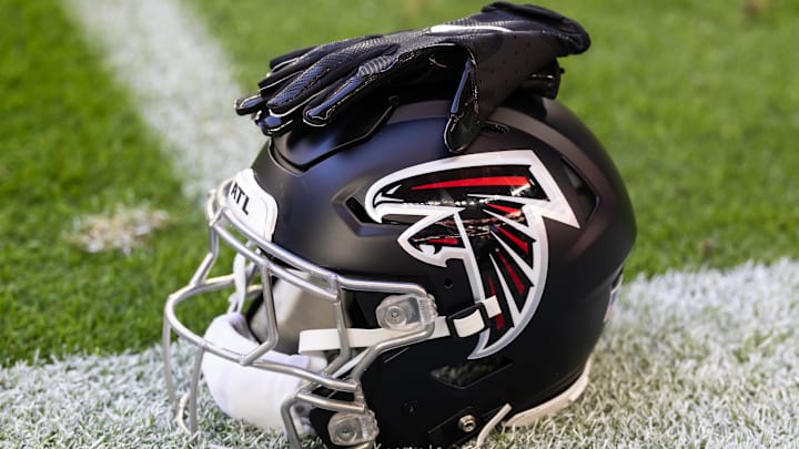 Dec 21, 2025; Glendale, Arizona, USA; Detailed view of an Atlanta Falcons helmet at State Farm Stadium. Mandatory Credit: Mark J. Rebilas-Imagn Images