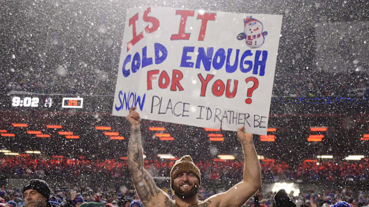 Dec 17, 2022; Orchard Park, New York, USA; A shirtless Buffalo Bills fan shows a sign during a game