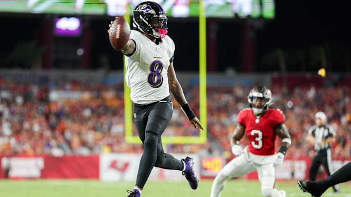 Baltimore Ravens quarterback Lamar Jackson (8) runs with the ball against the Tampa Bay Buccaneers in the second quarter at Raymond James Stadium. 
