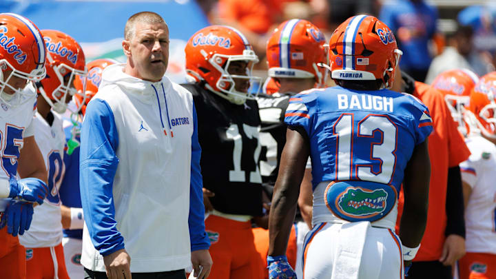Apr 12, 2025; Gainesville, FL, USA; Florida Gators head coach Billy Napier looks on while Florida Gators running back Jadan Baugh (13) walks by before the game at Ben Hill Griffin Stadium. Mandatory Credit: Matt Pendleton-Imagn Images Apr 12, 2025; Gainesville, FL, USA; Florida Gators head coach Billy Napier looks on while Florida Gators running back Jadan Baugh (13) walks by before the game at Ben Hill Griffin Stadium. Mandatory Credit: Matt Pendleton-Imagn Images