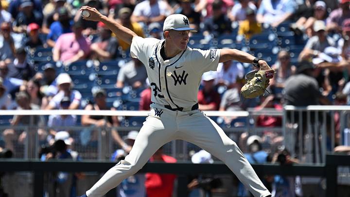 Jun 12, 2026; Omaha, NE, USA; West Virginia Mountaineers starting pitcher Chansen Cole (35) throws against the Troy Trojans during the first inning at Charles Schwab Field. Mandatory Credit: Steven Branscombe-Imagn Images Jun 12, 2026; Omaha, NE, USA; West Virginia Mountaineers starting pitcher Chansen Cole (35) throws against the Troy Trojans during the first inning at Charles Schwab Field. Mandatory Credit: Steven Branscombe-Imagn Images