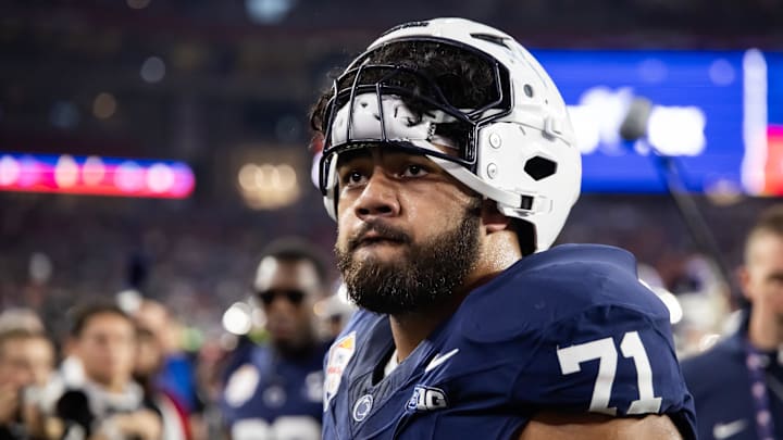 Dec 31, 2024; Glendale, AZ, USA; Penn State Nittany Lions offensive lineman Olaivavega Ioane (71) against the Boise State Broncos during the Fiesta Bowl at State Farm Stadium. Mandatory Credit: Mark J. Rebilas-Imagn Images