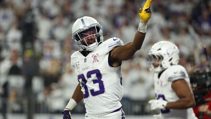 Dec 25, 2025; Minneapolis, Minnesota, USA; Minnesota Vikings running back Aaron Jones Sr. (33) celebrates after scoring a touchdown against the Detroit Lions in the first quarter at U.S. Bank Stadium.
