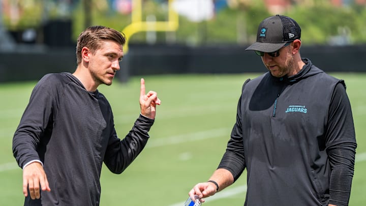 Jacksonville Jaguars general manager James Gladstone, left, talks with Jacksonville Jaguars head coach Liam Coen, right, after the. Jacksonville Jaguars’ mandatory minicamp Tuesday June 10, 2025 at the Miller Electric Center in Jacksonville, Fla. [Doug Engle/Florida Times-Union]