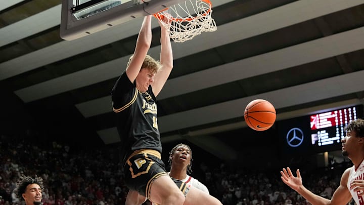 Purdue center Daniel Jacobsen (12) dunks against Alabama at Coleman Coliseum.