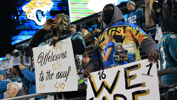 Jacksonville Jaguars fans yell before an NFL first-round playoff football matchup between.