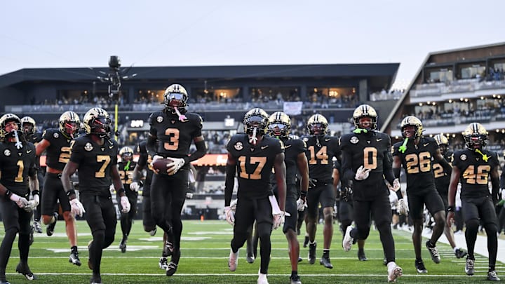 Nov 22, 2025; Nashville, Tennessee, USA;  Vanderbilt Commodores cornerback Kolbey Taylor (3) celebrates with his teammates after the interception against the Kentucky Wildcats during the first half at FirstBank Stadium. Mandatory Credit: Steve Roberts-Imagn Images
