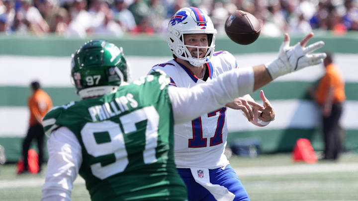 Buffalo Bills’ quarterback Josh Allen (17) and New York Jets defensive tackle Harrison Phillips (97).