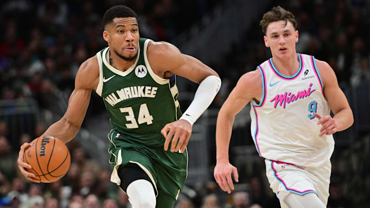 Jan 23, 2025; Milwaukee, Wisconsin, USA; Milwaukee Bucks forward Giannis Antetokounmpo (34) drives for the basket against Miami Heat guard Pelle Larsson (9) in the third quarter at Fiserv Forum. Mandatory Credit: Benny Sieu-Imagn Images