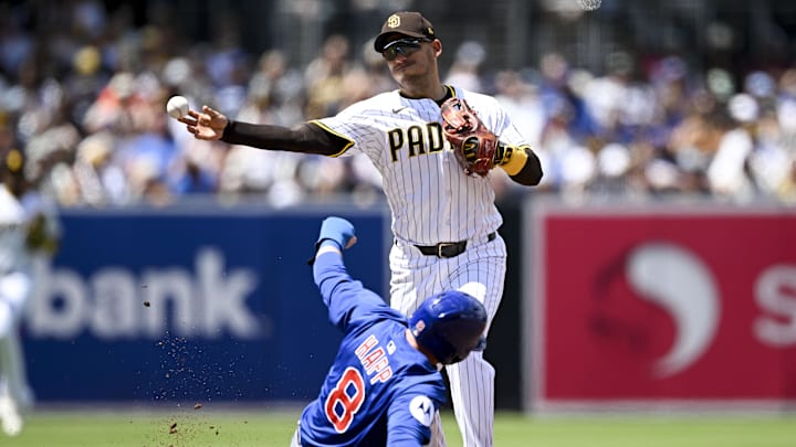 Apr 16, 2025; San Diego, California, USA; San Diego Padres second baseman Jose Iglesias (7) throws over Chicago Cubs left fielder Ian Happ (8) as he turns a double play during the third inning at Petco Park. Mandatory Credit: Denis Poroy-Imagn Images Apr 16, 2025; San Diego, California, USA; San Diego Padres second baseman Jose Iglesias (7) throws over Chicago Cubs left fielder Ian Happ (8) as he turns a double play during the third inning at Petco Park. Mandatory Credit: Denis Poroy-Imagn Images