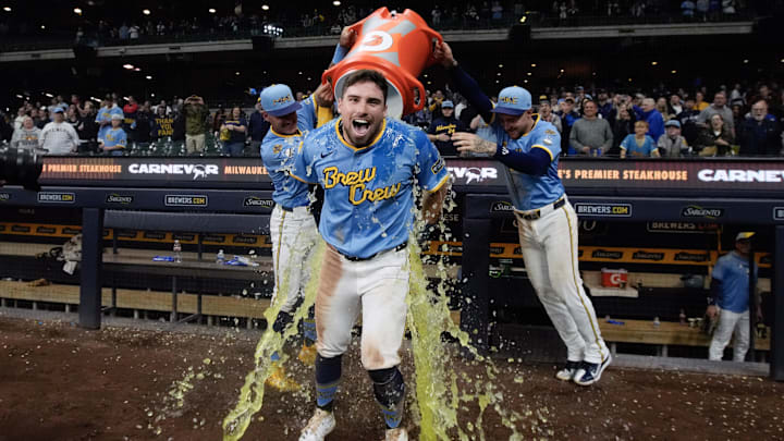 Apr 18, 2025; Milwaukee, Wisconsin, USA;  Milwaukee Brewers third baseman Caleb Durbin (21) gets dunked with Gatorade following the game against the Athletics at American Family Field. Mandatory Credit: Jeff Hanisch-Imagn Images