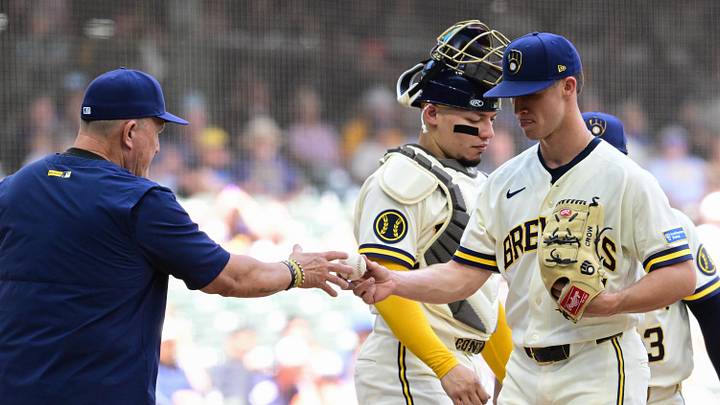 Jun 4, 2026; Milwaukee, Wisconsin, USA;  Milwaukee Brewers starting pitcher Coleman Crow (57) hands the ball to manager Pat Murphy during a pitching change in the third inning against the San Francisco Giants at American Family Field. Mandatory Credit: Benny Sieu-Imagn Images