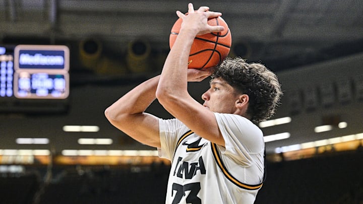 Nov 20, 2025; Iowa City, Iowa, USA; Iowa Hawkeyes guard Isaia Howard (23) shoots the ball against the Chicago State Cougars during the second half at Carver-Hawkeye Arena. Mandatory Credit: Jeffrey Becker-Imagn Images