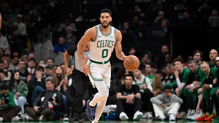 Apr 11, 2025; Boston, Massachusetts, USA; Boston Celtics forward Jayson Tatum (0) dribbles the ball against the Charlotte Hornets during the first half at TD Garden. Mandatory Credit: Eric Canha-Imagn Images