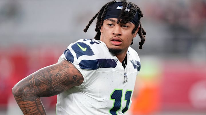 Jan 7, 2024; Glendale, Arizona, USA; Seattle Seahawks wide receiver Jaxon Smith-Njigba (11) warms up prior to facing the Arizona Cardinals at State Farm Stadium. Mandatory Credit: Joe Camporeale-Imagn Images