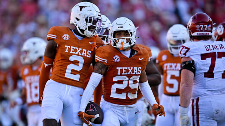 Oct 11, 2025; Dallas, Texas, USA; Texas Longhorns defensive back Derek Williams Jr. (2) and defensive back Graceson Littleton (29) celebrate after Littleton intercepts a pass from Oklahoma Sooners quarterback John Mateer (not pictured) during the second half at the Cotton Bowl. Mandatory Credit: Jerome Miron-Imagn Images Oct 11, 2025; Dallas, Texas, USA; Texas Longhorns defensive back Derek Williams Jr. (2) and defensive back Graceson Littleton (29) celebrate after Littleton intercepts a pass from Oklahoma Sooners quarterback John Mateer (not pictured) during the second half at the Cotton Bowl. Mandatory Credit: Jerome Miron-Imagn Images