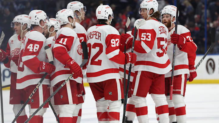 Apr 11, 2025; Tampa, Florida, USA; Detroit Red Wings right wing Vladimir Tarasenko (11), center Marco Kasper (92), defenseman Moritz Seider (53) and teammates celebrate after they beat the Tampa Bay Lightning at Amalie Arena. Mandatory Credit: Kim Klement Neitzel-Imagn Images
