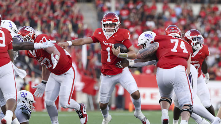 Houston Cougars quarterback Conner Weigman (1) runs with the ball during the first quarter against the Stephen F. Austin Lumberjacks Houston Cougars quarterback Conner Weigman (1) runs with the ball during the first quarter against the Stephen F. Austin Lumberjacks