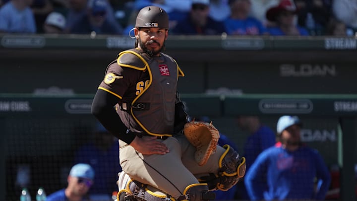 Mar 4, 2025; Mesa, Arizona, USA; San Diego Padres catcher Luis Campusano (12) looks for a sign against the Chicago Cubs in the third inning at Sloan Park. Mandatory Credit: Rick Scuteri-Imagn Images