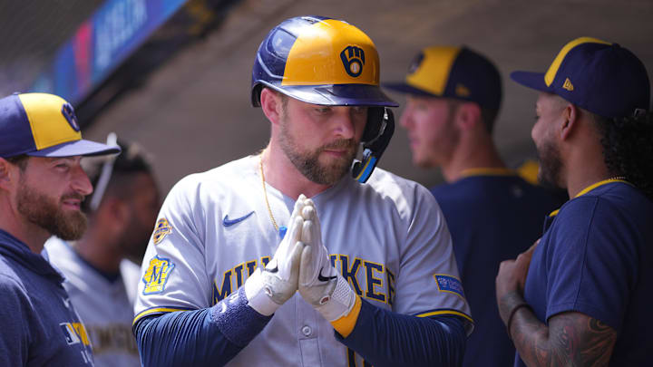 Jun 22, 2025; Minneapolis, Minnesota, USA; Milwaukee Brewers first base Rhys Hoskins (12) celebrates his run against the Minnesota Twins in the second inning at Target Field. Mandatory Credit: Brad Rempel-Imagn Images