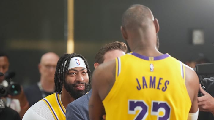 Sep 30, 2024; El Segundo, CA, USA; Los Angeles Lakers forward Anthony Davis (3) watches as ESPN reporter Dave McMenamin (center) interviews forward LeBron James (23) during media day at the UCLA Health Training Center. Mandatory Credit: Kirby Lee-Imagn Images Sep 30, 2024; El Segundo, CA, USA; Los Angeles Lakers forward Anthony Davis (3) watches as ESPN reporter Dave McMenamin (center) interviews forward LeBron James (23) during media day at the UCLA Health Training Center. Mandatory Credit: Kirby Lee-Imagn Images