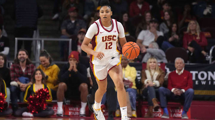 Dec 29, 2024; Los Angeles, California, USA; Southern California Trojans guard JuJu Watkins (12) dribbles the ball against the Michigan Wolverines in the first half at Galen Center. Mandatory Credit: Kirby Lee-Imagn Images