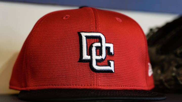 Jul 11, 2025; Milwaukee, Wisconsin, USA;  General view of a Washington Nationals cap in the dugout during batting practice prior to the game against the Milwaukee Brewers at American Family Field. Mandatory Credit: Jeff Hanisch-Imagn Images