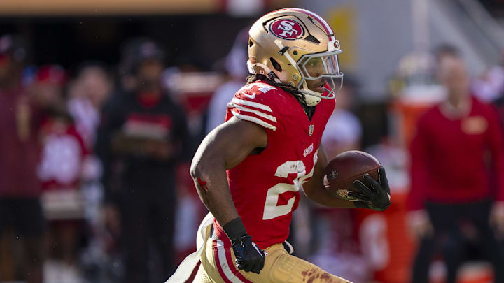 October 20, 2024; Santa Clara, California, USA; San Francisco 49ers running back Jordan Mason (24) runs the football against the Kansas City Chiefs during the third quarter at Levi's Stadium. Mandatory Credit: Kyle Terada-Imagn Images