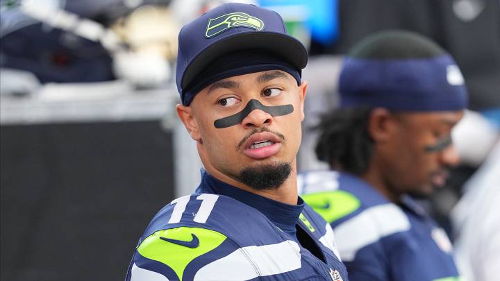 Seattle Seahawks wide receiver Jaxon Smith-Njigba (11) looks on from the sideline during the first half against the Arizona Cardinals at State Farm Stadium. Seattle Seahawks wide receiver Jaxon Smith-Njigba (11) looks on from the sideline during the first half against the Arizona Cardinals at State Farm Stadium.