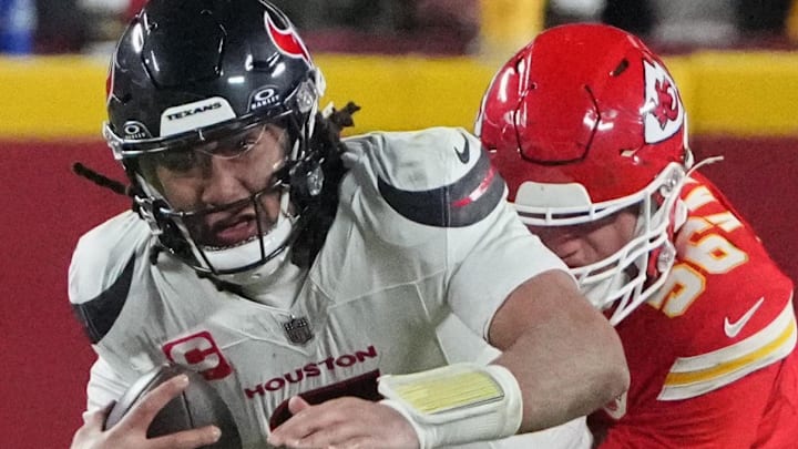 Jan 18, 2025; Kansas City, Missouri, USA; Houston Texans quarterback C.J. Stroud (7) is sacked by Kansas City Chiefs defensive end George Karlaftis (56) during the fourth quarter of a 2025 AFC divisional round game at GEHA Field at Arrowhead Stadium. Mandatory Credit: Denny Medley-Imagn Images Jan 18, 2025; Kansas City, Missouri, USA; Houston Texans quarterback C.J. Stroud (7) is sacked by Kansas City Chiefs defensive end George Karlaftis (56) during the fourth quarter of a 2025 AFC divisional round game at GEHA Field at Arrowhead Stadium. Mandatory Credit: Denny Medley-Imagn Images