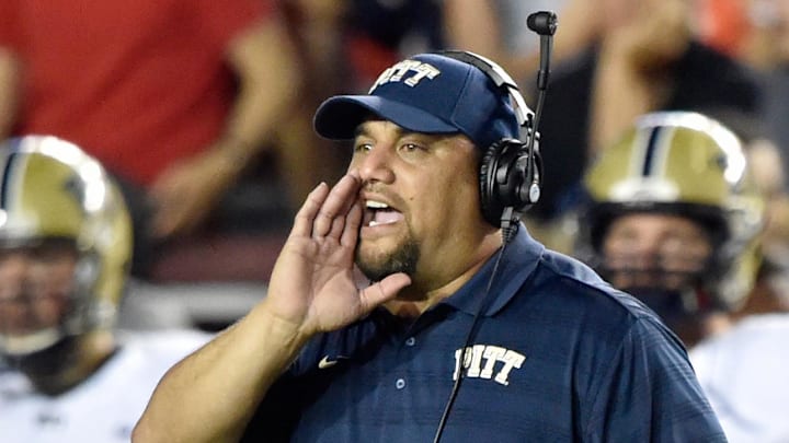 Sep 5, 2014; Boston, MA, USA; Pittsburgh Panthers defensive tackles coach Inoke Breckterfield directs players on the field against the Boston College Eagles during the first half at Alumni Stadium. Pitt won 30-20 over Boston College. Mandatory Credit: Gregory J. Fisher-Imagn Images