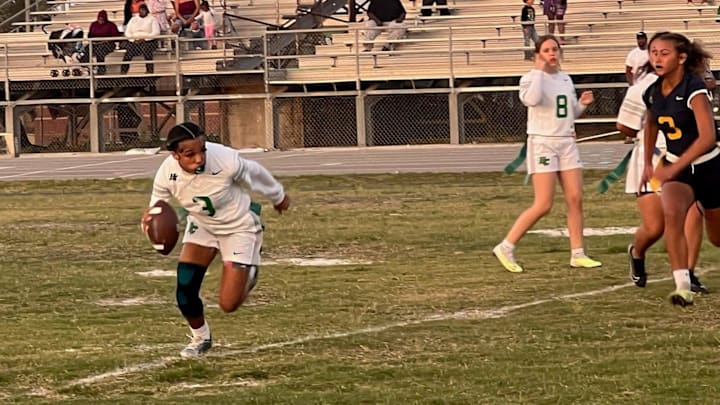 Haines City's Zebrielle Canaday runs around the edge in a Class 2A, District 11 Championship game Thursday at Haines City High School. She scored four touchdowns in the game.