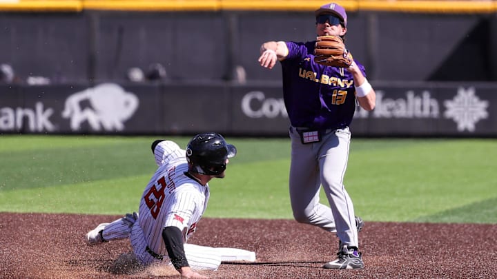 UAlbany's Cooper Loyal attempts to turn a double play against Texas Tech during a non-conference baseball game, Sunday, Feb. 22, 2026, at Rip Griffin Park.