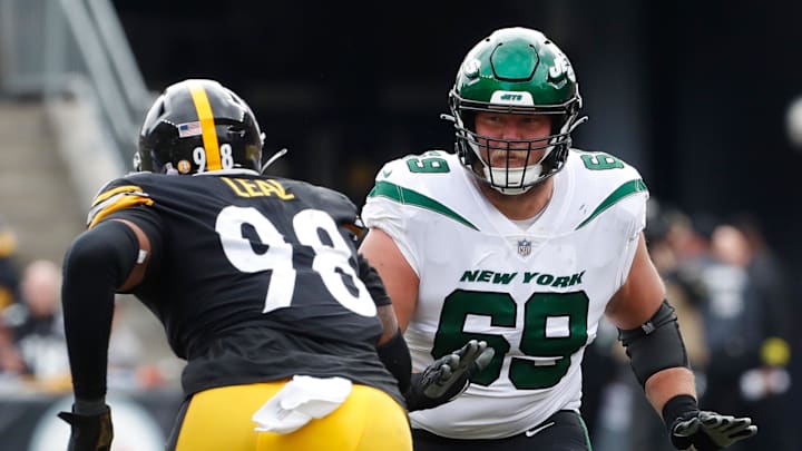 Oct 2, 2022; Pittsburgh, Pennsylvania, USA;  New York Jets offensive tackle Conor McDermott (69) blocks at he line of scrimmage against Pittsburgh Steelers defensive end DeMarvin Leal (98) during the second quarter at Acrisure Stadium. Mandatory Credit: Charles LeClaire-USA TODAY Sports