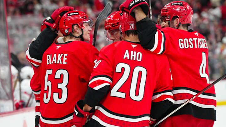 Apr 2, 2025; Raleigh, North Carolina, USA;  Carolina Hurricanes right wing Jackson Blake (53) celebrates a goal with center Seth Jarvis (24), left wing Taylor Hall (71), defenseman Shayne Gostisbehere (4) and center Sebastian Aho (20) against the Washington Capitals during the first period at Lenovo Center. Mandatory Credit: James Guillory-Imagn Images