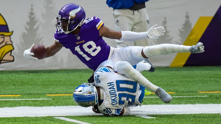 Nov 8, 2020; Minneapolis, Minnesota, USA; Detroit Lions defensive back Jeff Okudah (30) tackles Minnesota Vikings wide receiver Justin Jefferson (18) in the first quarter at U.S. Bank Stadium.