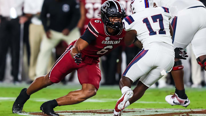 Sep 6, 2025; Columbia, South Carolina, USA; South Carolina Gamecocks linebacker Dylan Stewart (6) brings down South Carolina State Bulldogs running back KZ Adams (17) in the first quarter at Williams-Brice Stadium. Mandatory Credit: Jeff Blake-Imagn Images