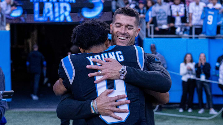 Nov 3, 2024; Charlotte, North Carolina, USA; Carolina Panthers head coach Dave Canales hugs quarterback Bryce Young (9) after getting the win against the New Orleans Saints at Bank of America Stadium. Mandatory Credit: Scott Kinser-Imagn Images