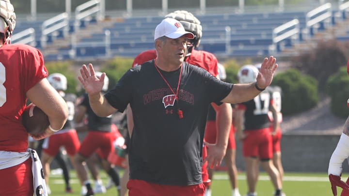 Wisconsin offensive line coach Jack Bicknell Jr. talks with his players during practice on Sunday Aug. 6, 2023 at Pioneer Stadium in Platteville, Wis.