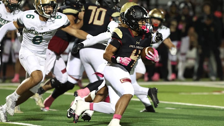 Running back Deshonne Redeaux finds an opening during the first quarter of Oaks Christian's 35-0 Marmonte League win over St. Bonaventure Friday night at Redell Field. Running back Deshonne Redeaux finds an opening during the first quarter of Oaks Christian's 35-0 Marmonte League win over St. Bonaventure Friday night at Redell Field.