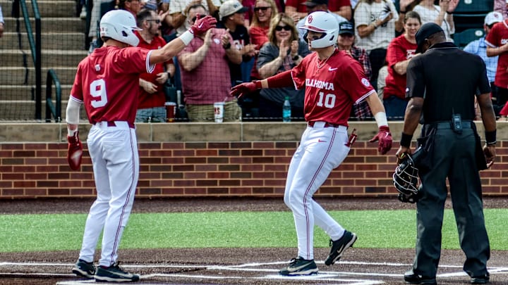Oklahoma's Camden Johnson celebrates with Brendan Brock Oklahoma's Camden Johnson celebrates with Brendan Brock