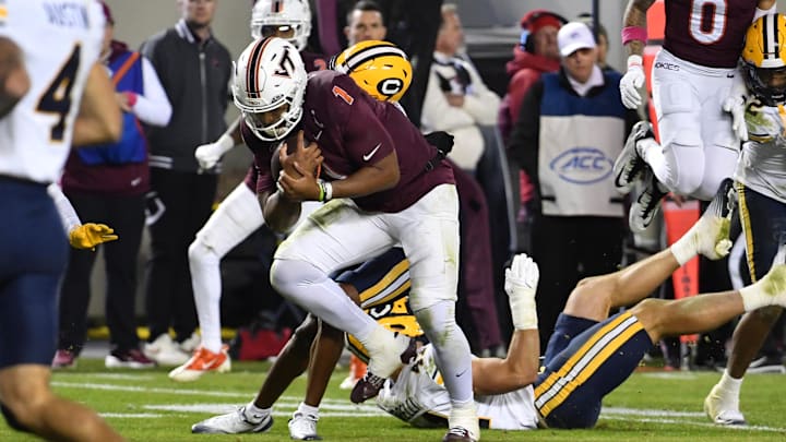 Oct 24, 2025; Blacksburg, Va.; Virginia Tech quarterback Kyron Drones (1) runs the ball for a touchdown against California.