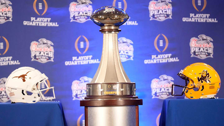 The Peach Bowl trophy on display before a joint news conference with Texas head coach Steve Sarkisian and Arizona State head coach Kenny Dillingham.