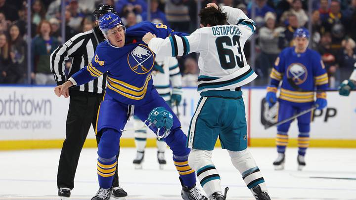Buffalo Sabres defenseman Logan Stanley fights San Jose Sharks forward Zack Ostapchuk
