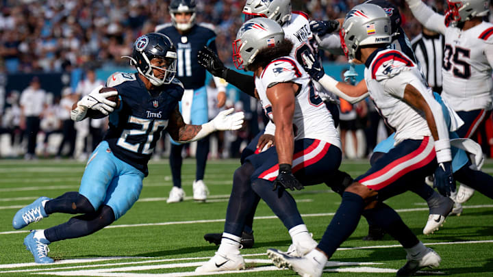 Tennessee Titans running back Tony Pollard (20) runs against the New England Patriots Tennessee Titans running back Tony Pollard (20) runs against the New England Patriots