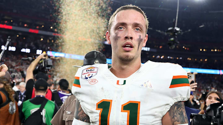 Jan 8, 2026; Glendale, AZ, USA; Miami Hurricanes quarterback Carson Beck (11) reacts after winning the 2026 Fiesta Bowl and semifinal game of the College Football Playoff at State Farm Stadium. Mandatory Credit: Mark J. Rebilas-Imagn Images