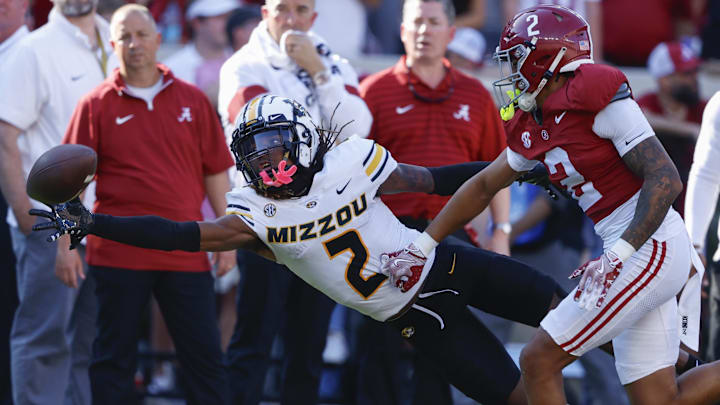 Oct 26, 2024; Tuscaloosa, Alabama, USA;  Missouri Tigers wide receiver Marquis Johnson (2) tries to pull in a reception against Alabama Crimson Tide defensive back Zabien Brown (2) during the first half at Bryant-Denny Stadium. Mandatory Credit: Butch Dill-Imagn Images